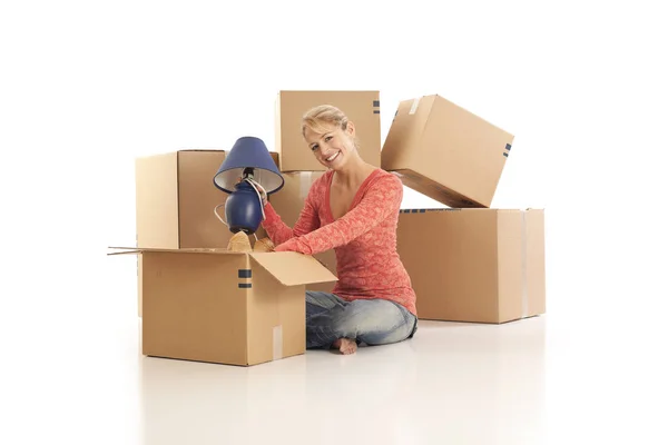 Young Woman Unpacking Cardboard Boxes — Stock Photo, Image