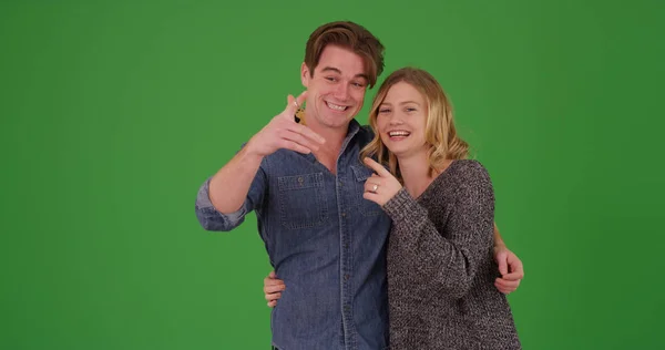 Happy Excited Homeowners Showing Key New Home Green Screen — Stock Photo, Image