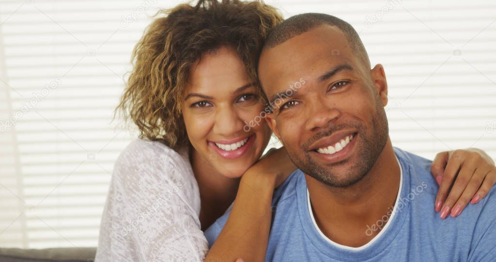 Happy Black couple smiling