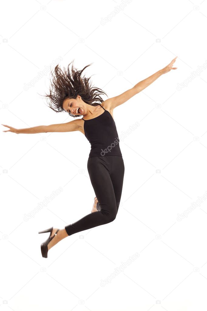 Cute young energetic girl wearing black dancing and jumping