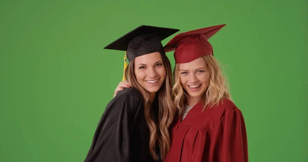 Pair Happy White Female College Graduates Posing Green Screen — Stock Photo, Image