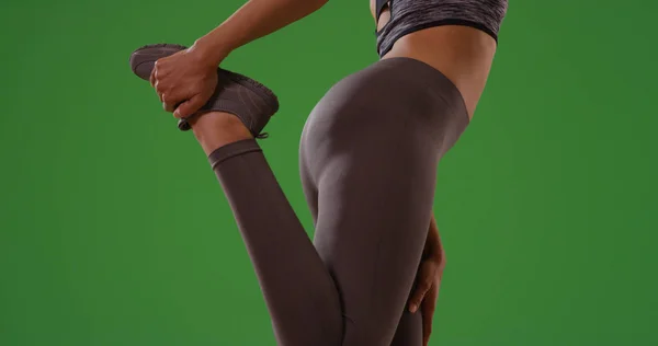 Sporty Black Female Sportswear Stretching Her Legs Green Screen — Stock Photo, Image