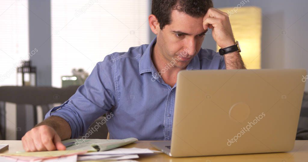 Man feeling frustrated with bills