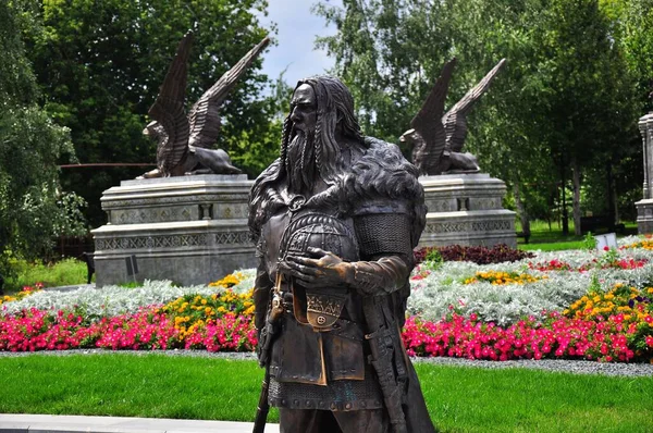 Knight statue near castle in a Russian village was built in memory of father