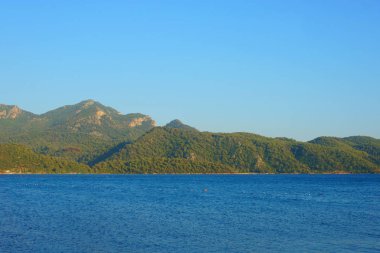 deniz manzarası, dağlar, kayalar, gökyüzü ve su