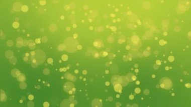 Renkli yeşil sarı parçacık arka plan ile parlayan bokeh ışıklar.