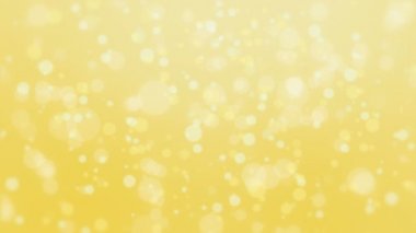 Hafif parçacıklar hareket ile güzel parlak sarı bokeh arka plan.