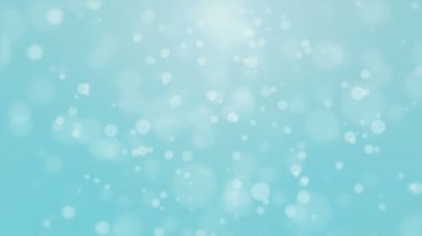 Havada süzülen bokeh ışıklarıyla ışıldayan şenlikli turkuaz mavi Noel arkaplanı.