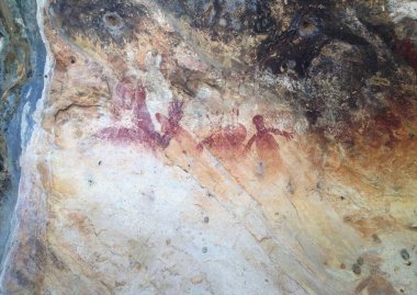 Ancient Aboriginal cave artwork on a rock face in Western Australia clipart