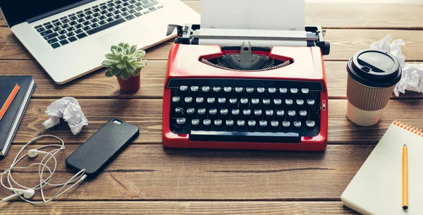 Vintage typewriter on wooden background