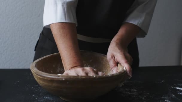 Baker hands kneading dough — Stock Video