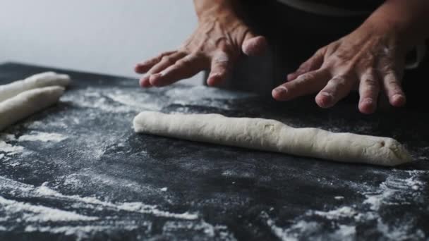 Woman rolling the dough by hands — Stock Video