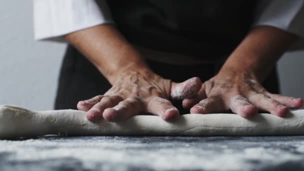 Woman rolling the dough by hands — Stock Video