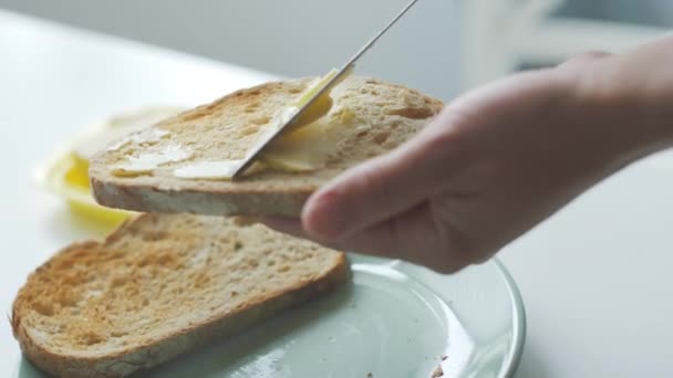 Person spreading creamy butter — Stock Video