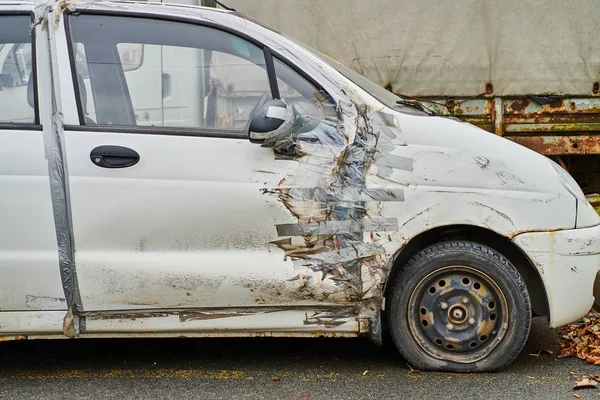Car with duct tape repair