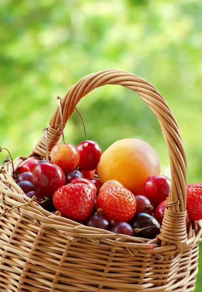 Berries Fruits Wicker Basket Green Blurred Background Close — Stock Photo, Image
