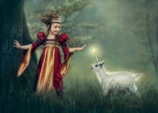 A little Princess met a small unicorn in the forest and tries to touch its horn.	