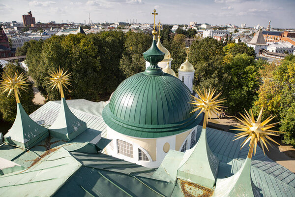 The roof of the Orthodox Cathedral in Russia. Top view of the dome of the temple and architectural elements.