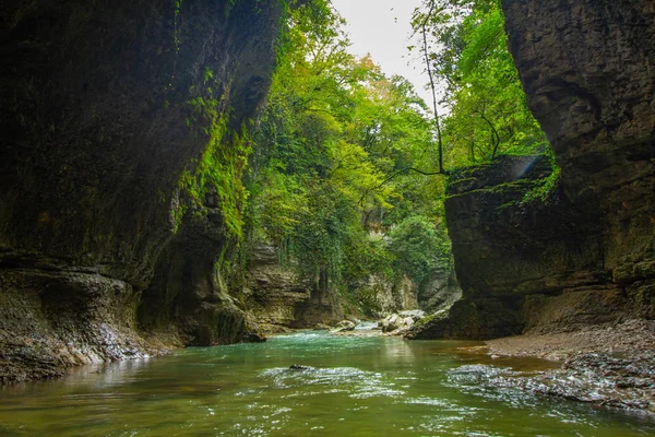 Amazing view on boat tour of the picturesque Martvili canyon in Georgia near Kutaisi. Beautiful natural canyon with view of the mountain river, christal blue water and boat ride.