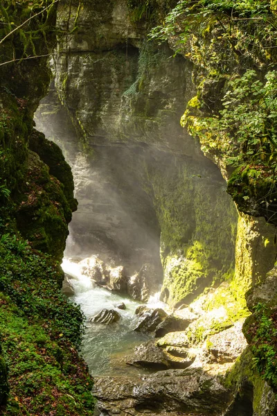 Amazing view on waterfall in the picturesque Martvili canyon in Georgia near Kutaisi. Beautiful natural canyon with view of the mountain river, christal blue water and boat ride.