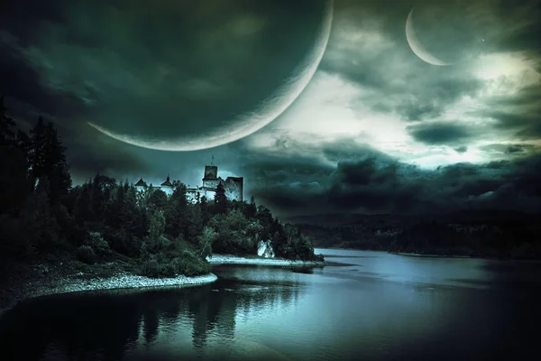 fantastic landscape with a castle on a hill by the lake. Cloudy night with fantastic planets. Landscape in shades of green