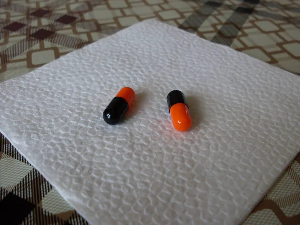 Black Orange Pills White Napkin Close — Stock Photo, Image