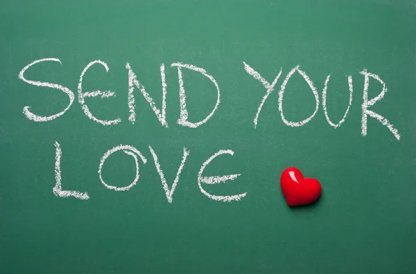 Send your love with red heart on green chalkboard