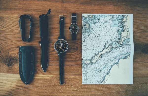 Vintage Diver Equipment Wooden Background Nautical Map Diver Watch Knife Stock Image