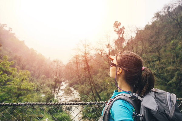 Hiker Girl Crossing Footbridge Royalty Free Stock Photos