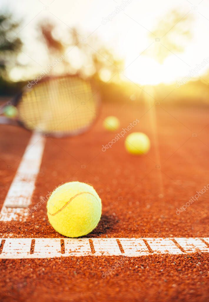 Tennis balls on clay court. Tennis ball in the field of tennis court
