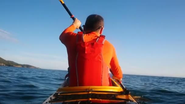Man Paddling Sea Kayak Rear View Kayaker Paddling Touring Kayak — Stock Video