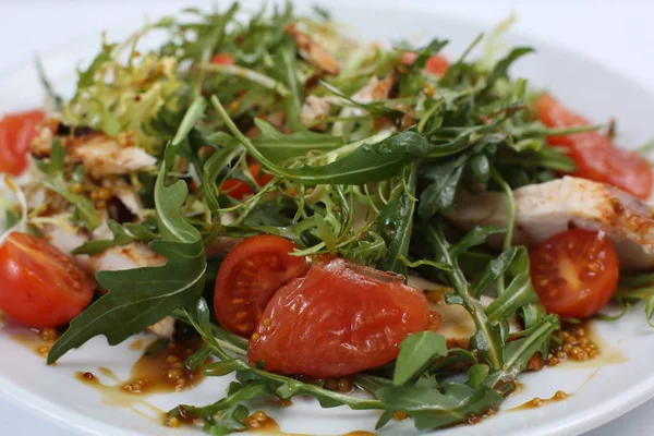 restaurant dish, green salad, cucumbers, red pepper, boiled meat, arugula, tomato and grapefruit, healthy food, close-up, for the menu