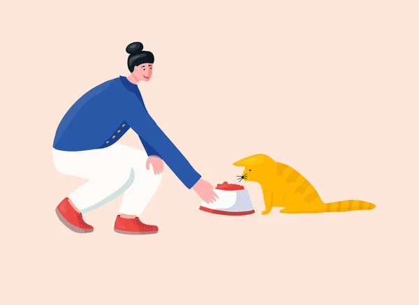 Menina voluntária alimentando gato perdido no abrigo animal . — Vetor de Stock