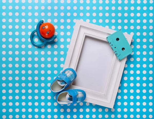 Baby Bootees Frame Blue Background — стоковое фото