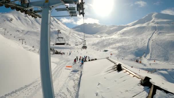 Aerial Shot Chairlift Ski Resort Crowd Skiers Skiing Snowy Mountains — Stock Video