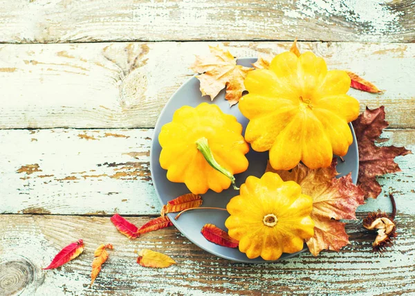 Yellow Pumpkins Autumn Leaves Plate Old Wooden Background Top View — Stock Photo, Image