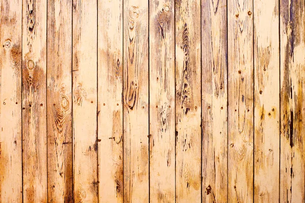 Brown wooden wall from boards close up. Vintage stained wooden wall background texture
