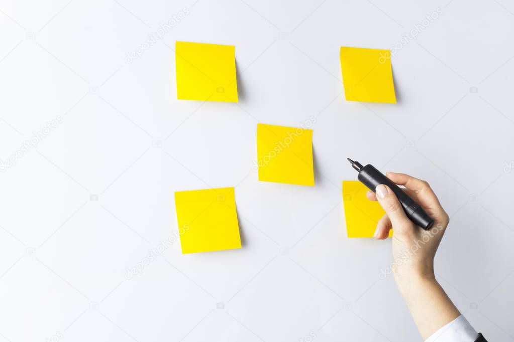 Woman writing on whiteboard