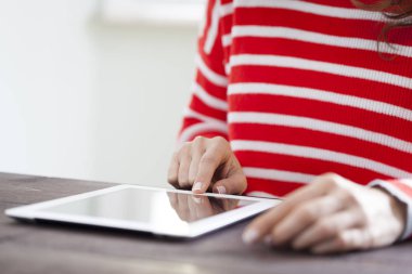 Woman using digital tablet computer, close up