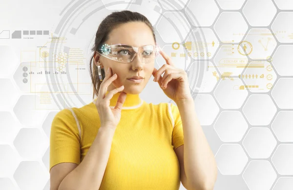 Young woman in futuristic background with virtual holographic gl — Stock Photo, Image