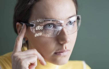 Woman in glasses with virtual screen