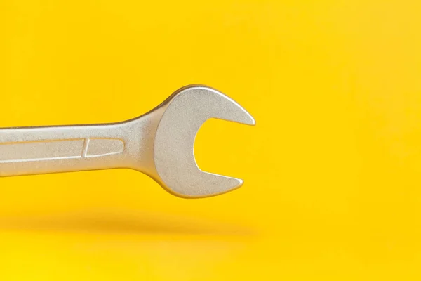 Wrench on yellow background — 스톡 사진