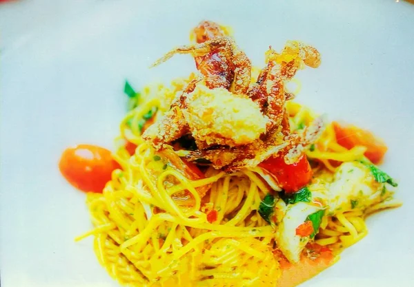 Italian seafood Spaghetti is a creamy red pepper sauce comes with this seafood pasta of prawn and soft shell crab. Pasta is a staple food of traditional Italian cuisine, with the first reference dating to 1154 in Sicily.