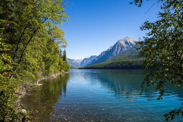 stock image View Across Lake Bowman with Small Waves and a Reflection of Mountains in Glacier National Park