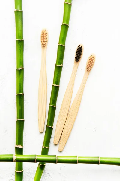 Flat Lay Composition Eco Friendly Bamboo Toothbrushes Bamboo Branch White — Stock Photo, Image