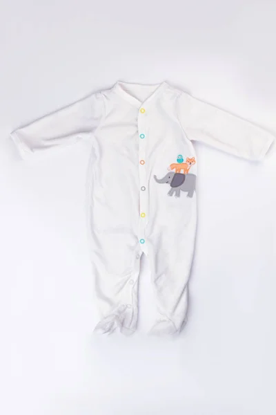 Footed baby pajamas isolated on white. Baby kid toddler sleepwear, top view.