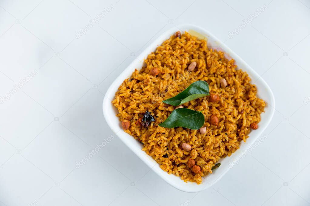 Spicy indian vegan/vegetarian food - tamarind flavored rice - Indian home cooked food with copy space