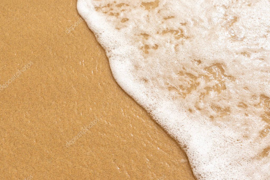 Soft sea wave on the golden sand of Morro Jable beach, Fuerteventura