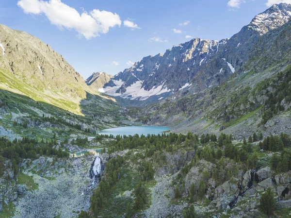 Kuiguk valley. Lake and waterfall in Altai mountains. Russian landscape