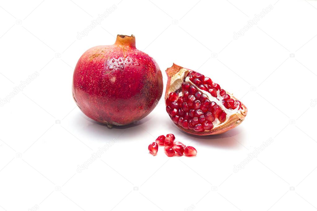Red pomegranate fruit isolated on a white background